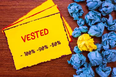 crumpled paper near note with vested