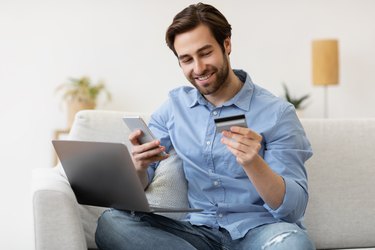 man with credit card and smartphone