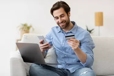 man with credit card and smartphone