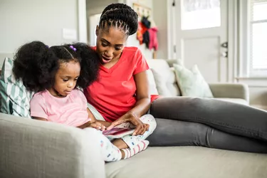 mother and daughter using tablet
