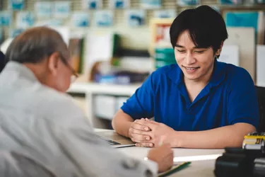 garage business service, client customer person make a payment with credit card or money to buy and repair at vehicle car auto maintenance center,  mechanic hand working to pay, transportation term