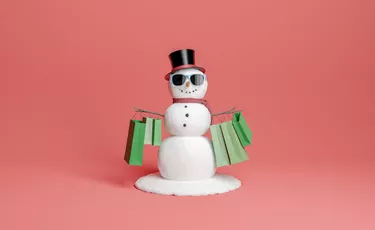 snowman in christmas and winter shopping concept