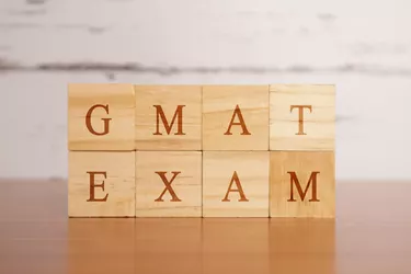 GMAT. Graduate Management Admission Test or exam in wooden block letters