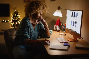 Middle aged woman buying online Christmas presents