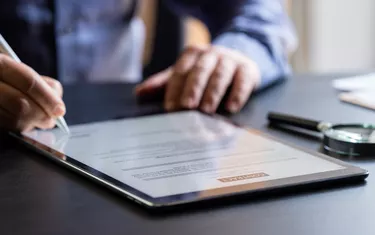 Man Signing The Digital Contract