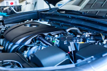Selective focus to automotive industrial part of modern new car engine room, Machine show all parts and open hood. Engine room.