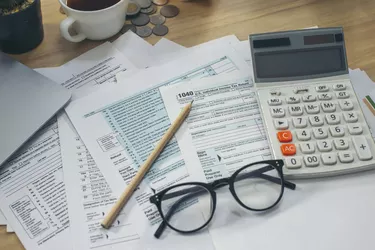 Individual Income Tax Return Form and calculator For who have income According to United States law. This is the season that has to pay and deadline for tax payment. Planning Budget and Tax Concept.