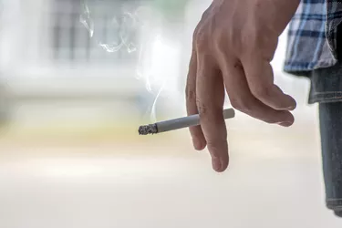 man smoking a cigarette
