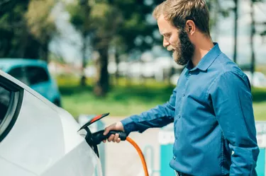 Man charging electric car