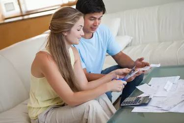 Couple cutting their credit card