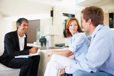 Couple discussing investment plans with consultant