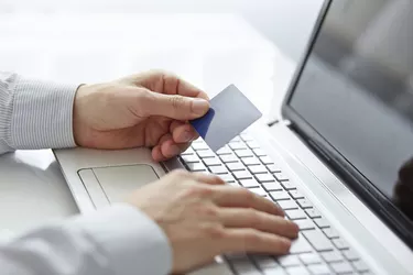 Male hands holding credit card