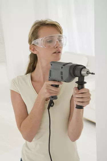 Woman using drill