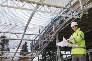 Engineer with blueprints