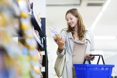 Beautiful young woman shopping in a grocery