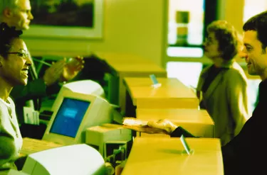 Customer Giving a Bank Teller Money