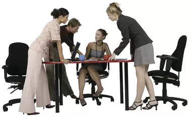 Team of Professional Women around Table