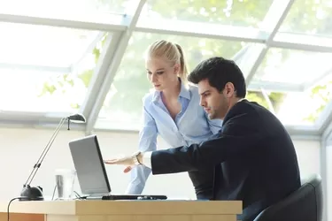 Business Team Working On Laptop