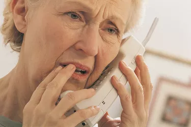 Worried woman on telephone