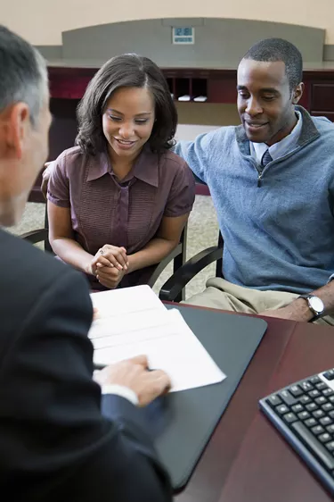 Couple talking to bank manager