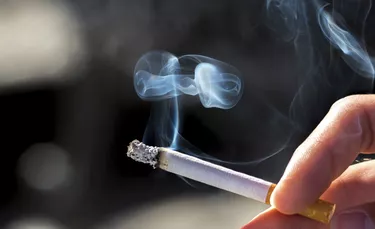 Holding a cigarette