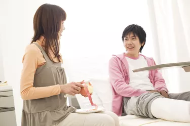 Woman peeling an apple for her boyfriend