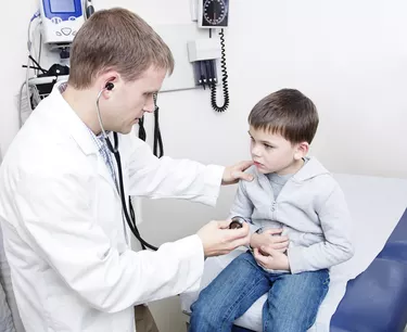 Doctor Examining sick little boy