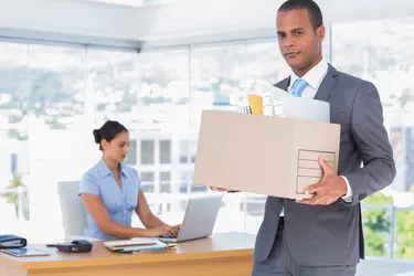 Unhappy businessman leaving the company