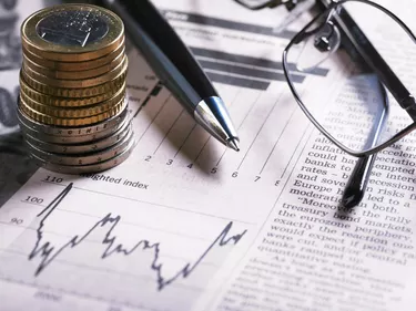 Financial Chart with Glasses And Coins