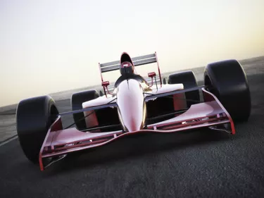 Race car racing on a track front view