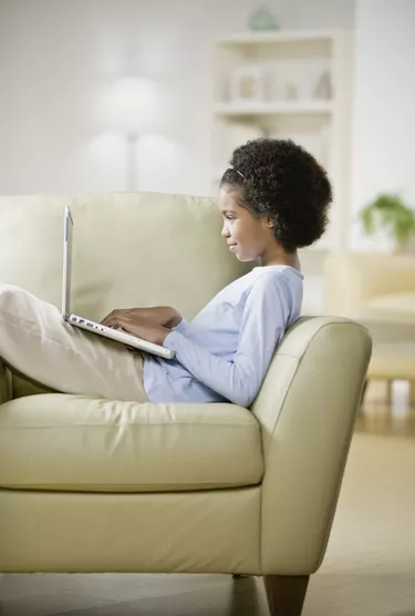 Woman typing on laptop