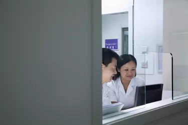 Doctors looking at computer screen
