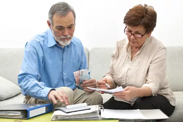 couple calculating home finances