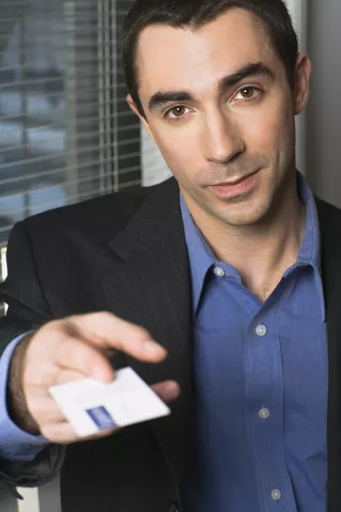 Businessman handing his business card