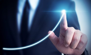 Business development to success and growing annual revenue growth concept, Businessman pointing arrow graph corporate future growth plan