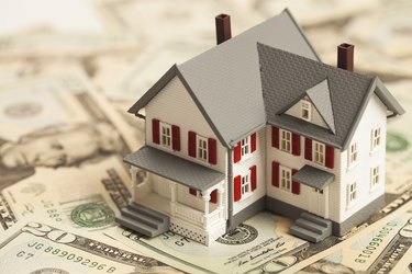 What Is an Escrow Number?                   Single family house on pile of money